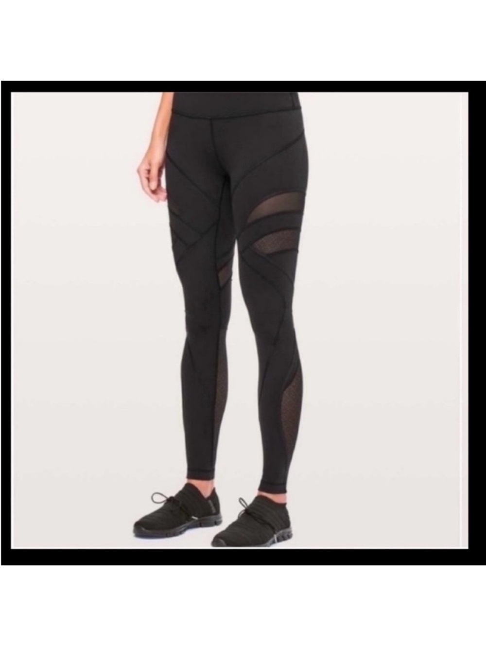 Black lululemon leggings size 2 with mesh cut outs and detailing